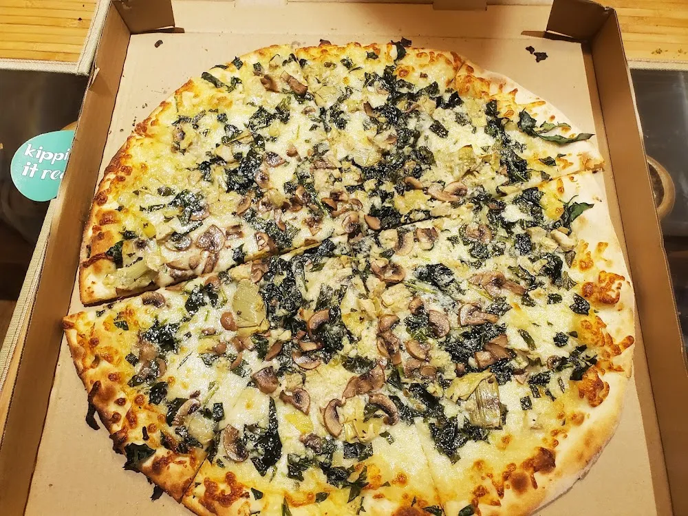 Garlic and Spinach Pizza with Added Mushrooms and Artichokes